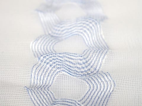 Warp knitted material with insulated copper filaments